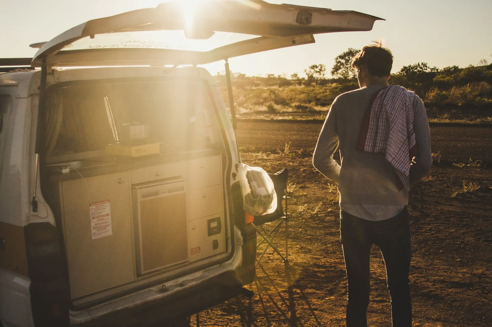 Tradie unloading a van at sunset in Karijini, Western Australia